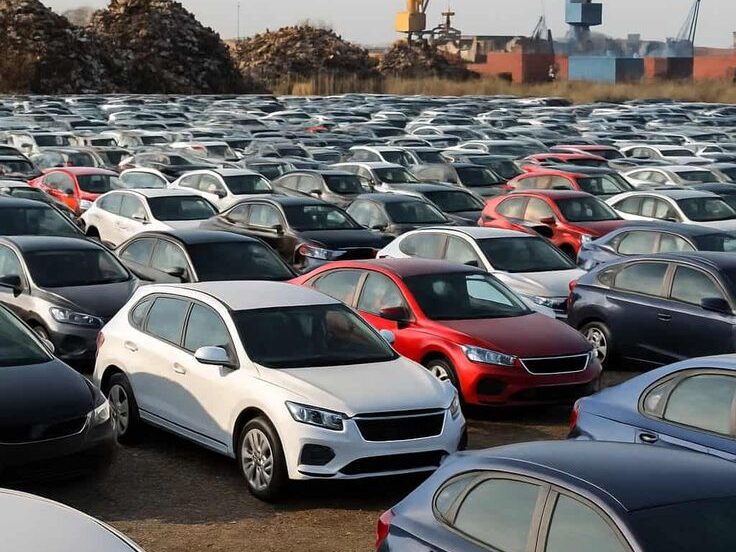Used car lot filled with multiple vehicles available for resale at a dealership